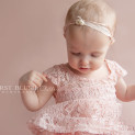Little girl swishing a dress in pink